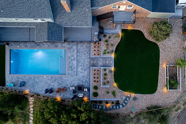 outdoor living space with pool, paver deck and artificial turf